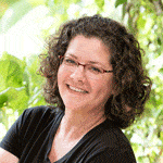 headshot of woman on green background