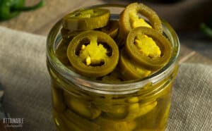 pickled jalapenos in a glass jar